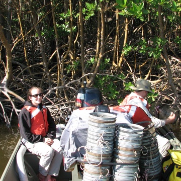 Lauren McCarthy and Bill Loftus retrieving minnow traps in Shark River