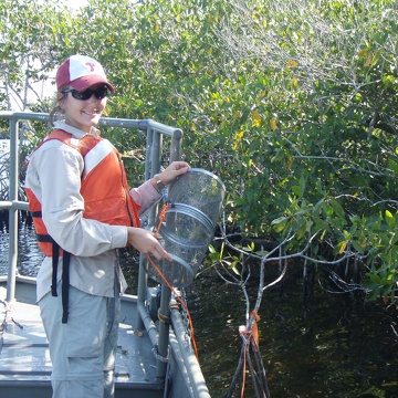 Lauren McCarthy with a minnow trap in Rookery Branch