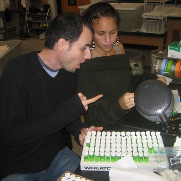 High school intern Nia and mentor Colin Saunders working in the lab