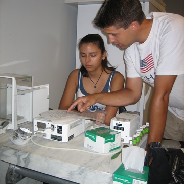 High school intern Magaly and mentor Jeff Wozniak working in the lab