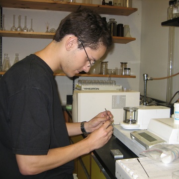 High school intern Hugo working in the lab