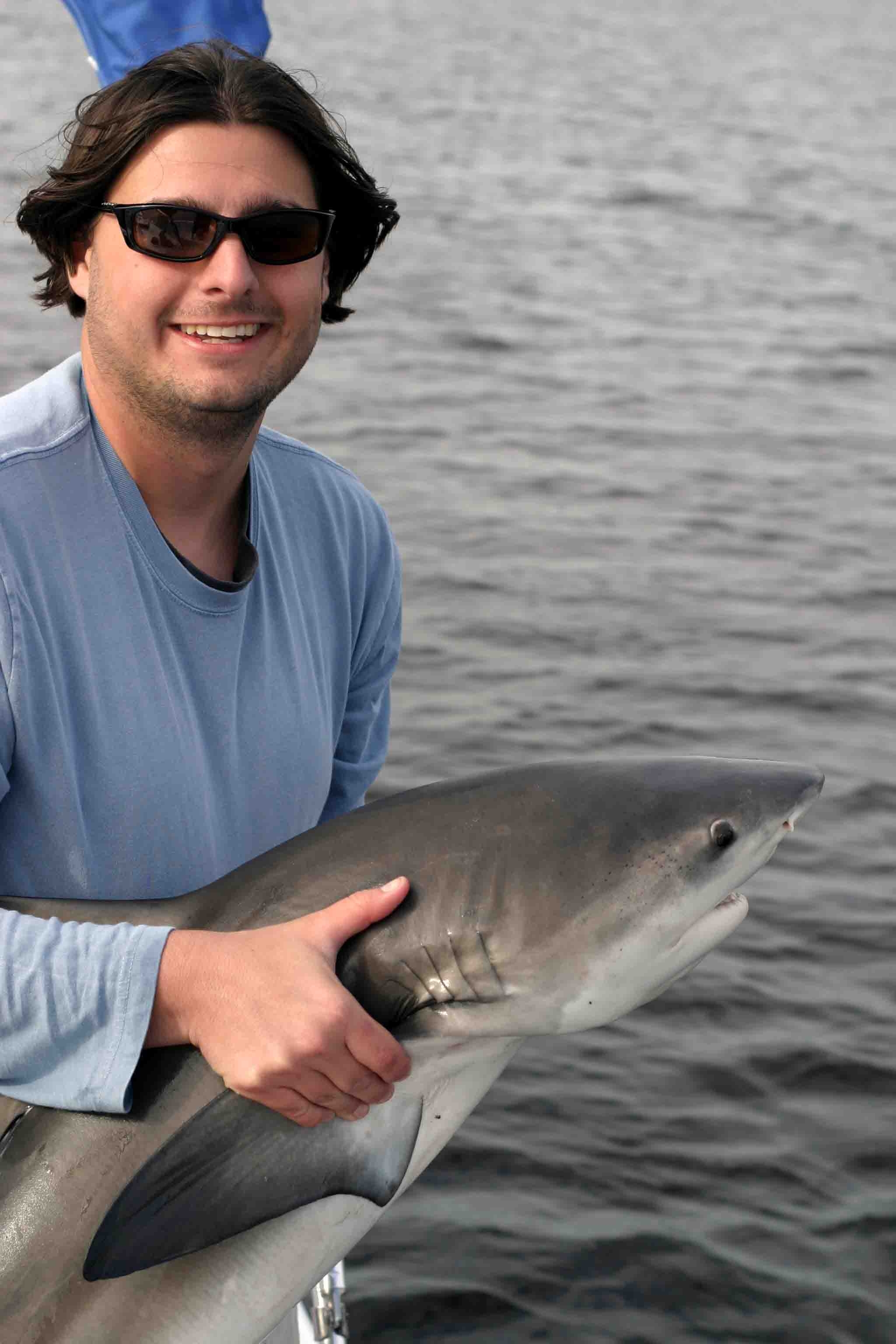 Bryan Delius (M.S. student) with a bull shark in Shark River