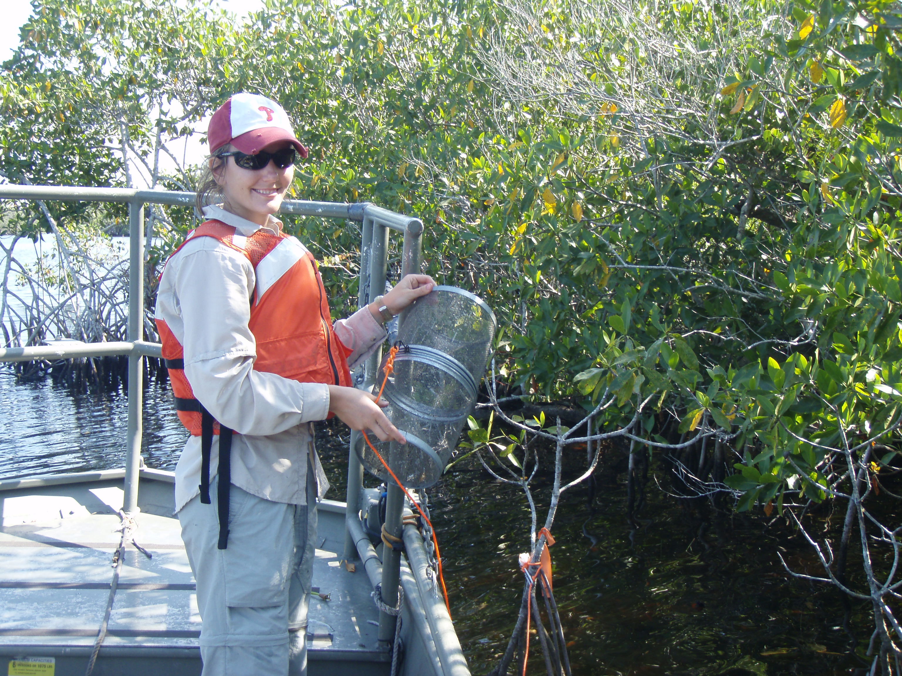 Lauren McCarthy with a minnow trap in Rookery Branch