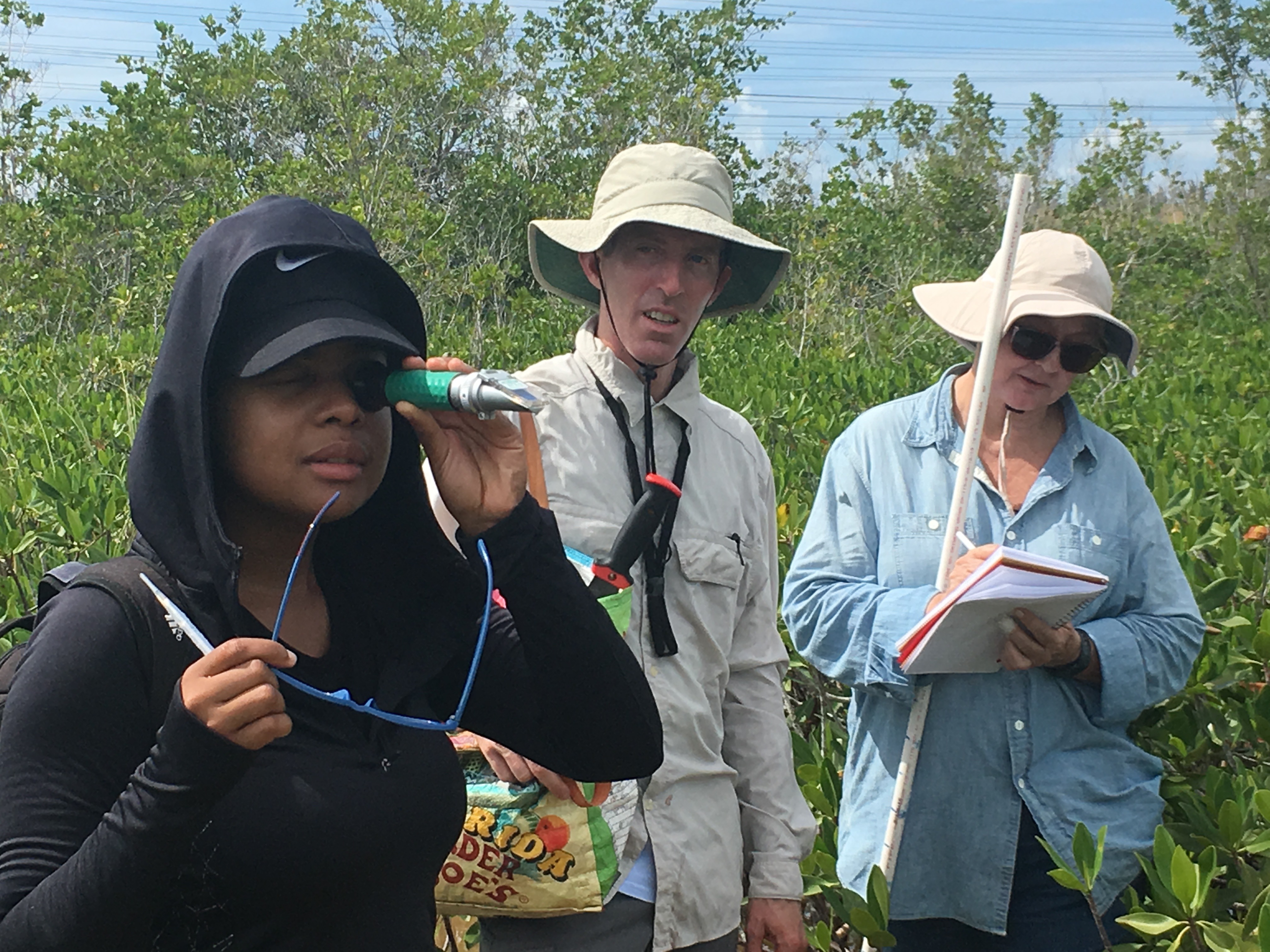 Priscilla Brown (FIU Teach Undergraduate, left foreground) using a salinity meter to measure salinity in Biscayne National Park.