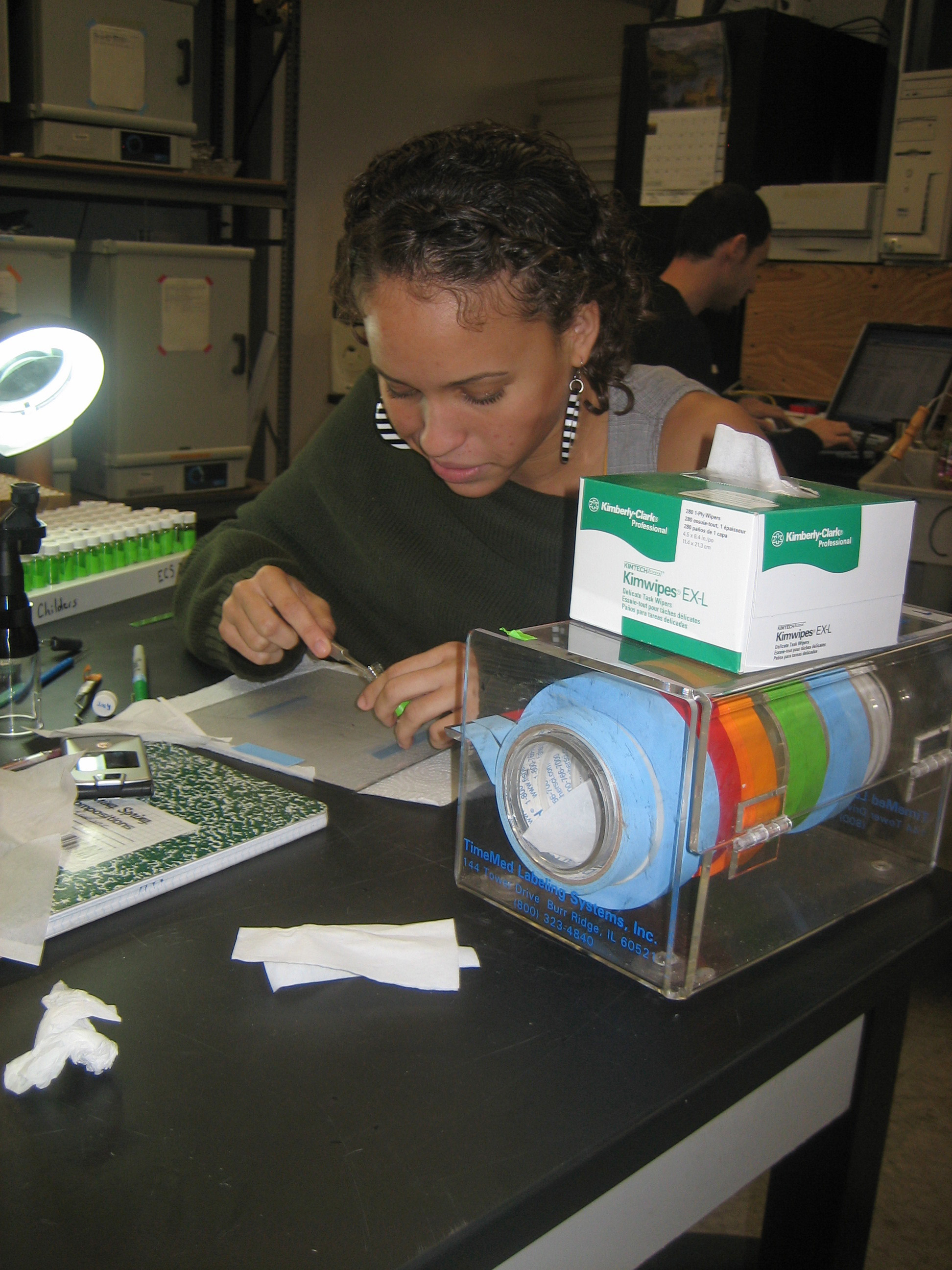High school intern Nia working in the lab