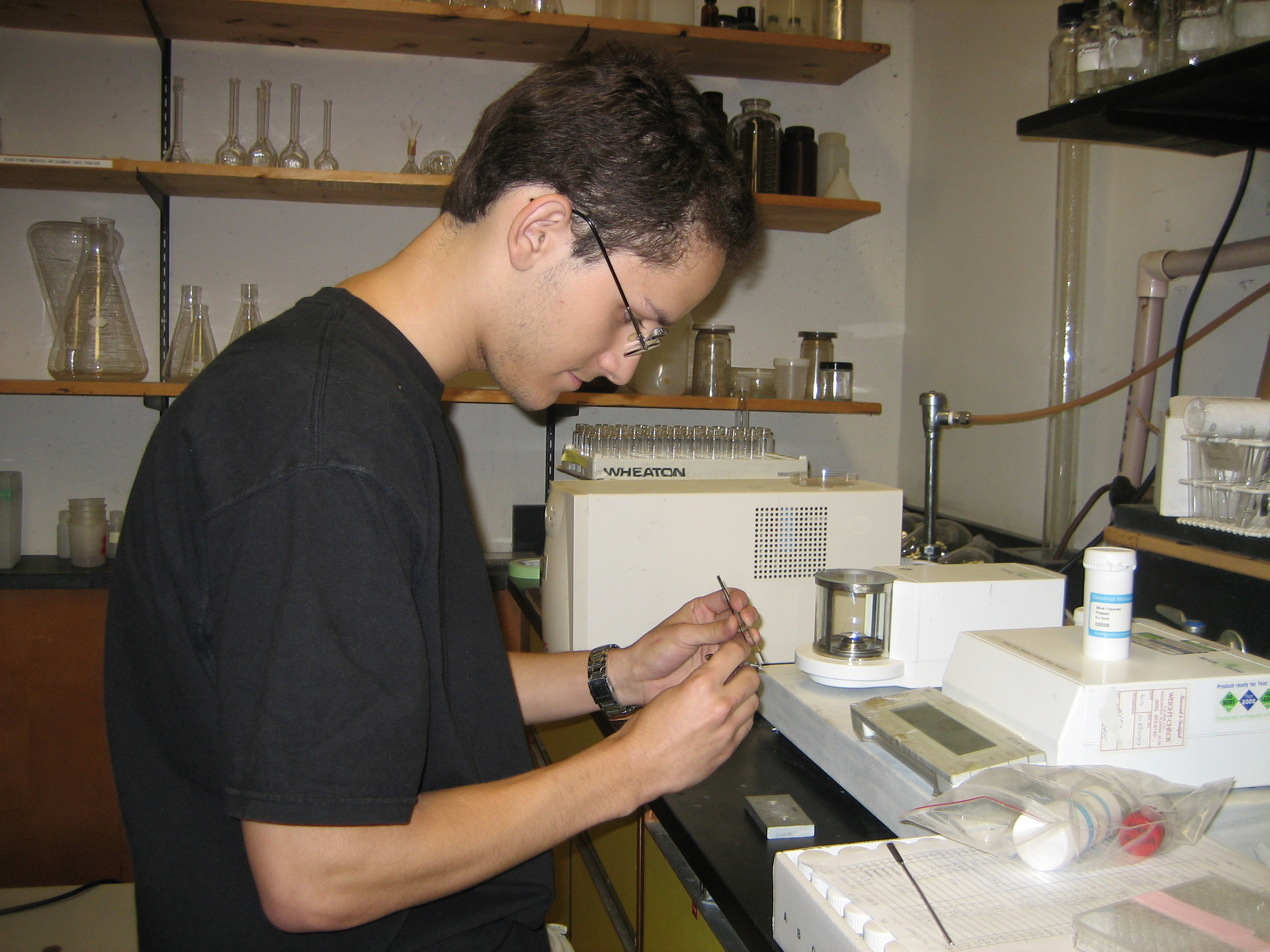 High school intern Hugo working in the lab